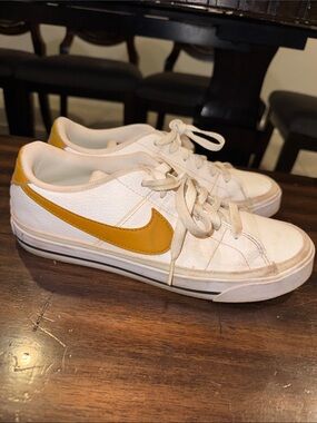 Nike Women's White Leather Sneakers with Yellow Swoosh